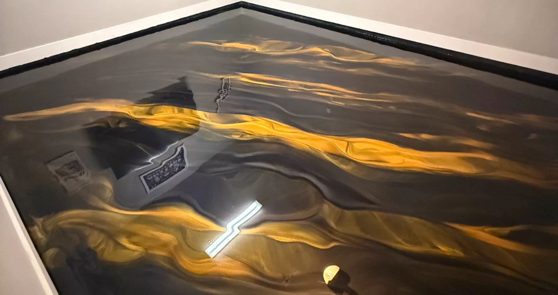 Black and gold metallic epoxy floor installed for a New Orleans, LA client
