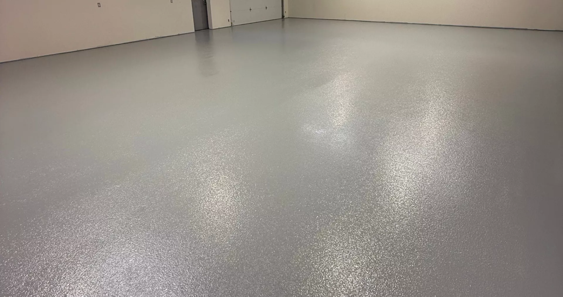 Light grey flake garage floor coating installed in Lafayette, LA