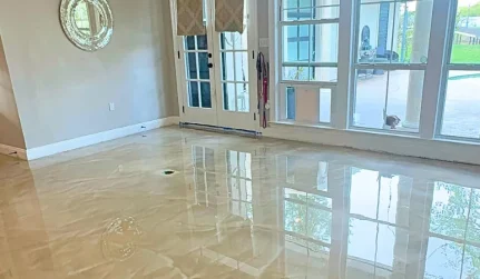 Tan and grey flake epoxy floor in a Lafayette, LA residential garage