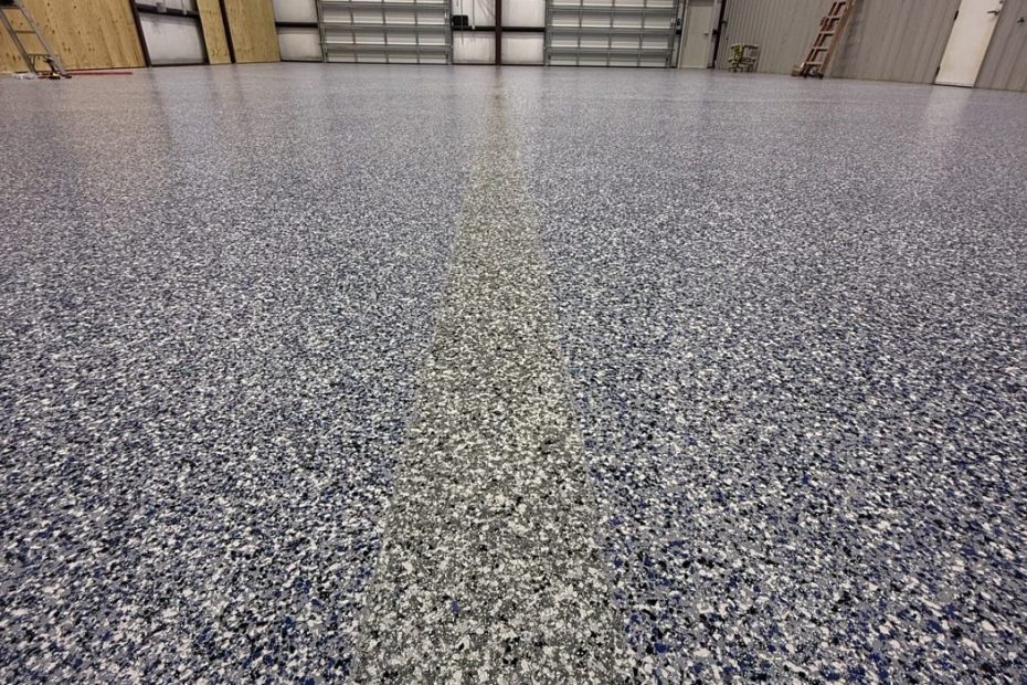 Close view of gray, black and white flake epoxy floor texture under a clear topcoat